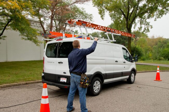 Outside view pf Prime Design ladder rack installed on a Ford Transit.