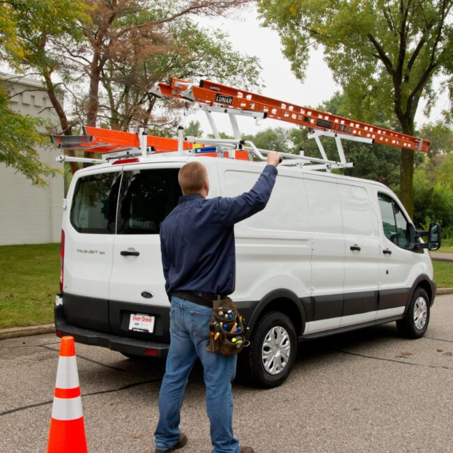 Outside view pf Prime Design ladder rack installed on a Ford Transit.