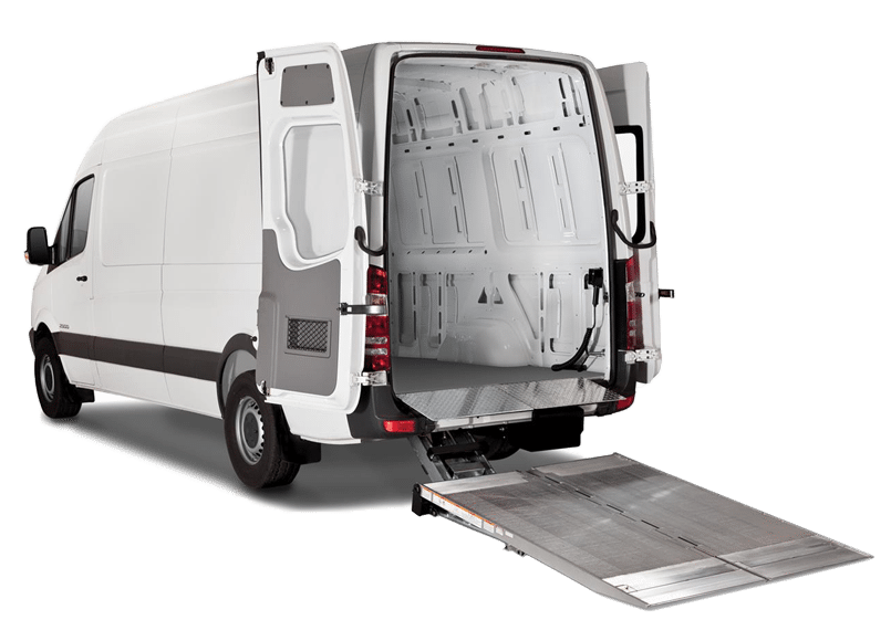 The back of a van with the doors open and a rank leading inside