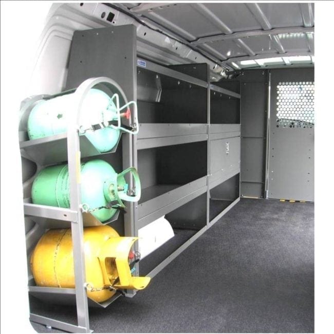 Shelves in the back of a van next to three containers